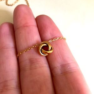 Fossil Rose Gold Coloured Necklace with Knot Pendant.